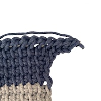 a close up of a blue and grey crochet stitch