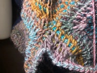 a close up of a knitted shawl