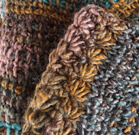 a close up of a knitted scarf