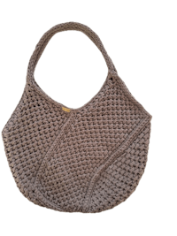 a grey crocheted bag on a black background